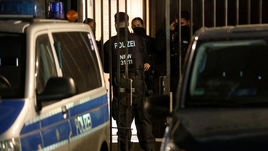 German police walk in front of the cathedral in central Cologne, Germany, December 23, 2023.     REUTERS/Thilo Schmuelgen