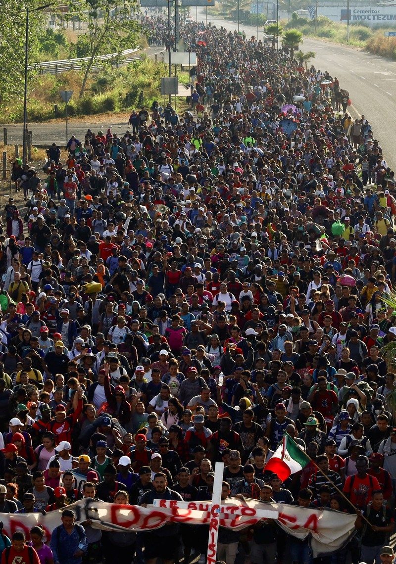 Migrants walk as they leave Tapachula in a caravan to attempt to reach the U.S. border, in the state of Chiapas, Mexico December 24, 2023. REUTERS/Jose Torres