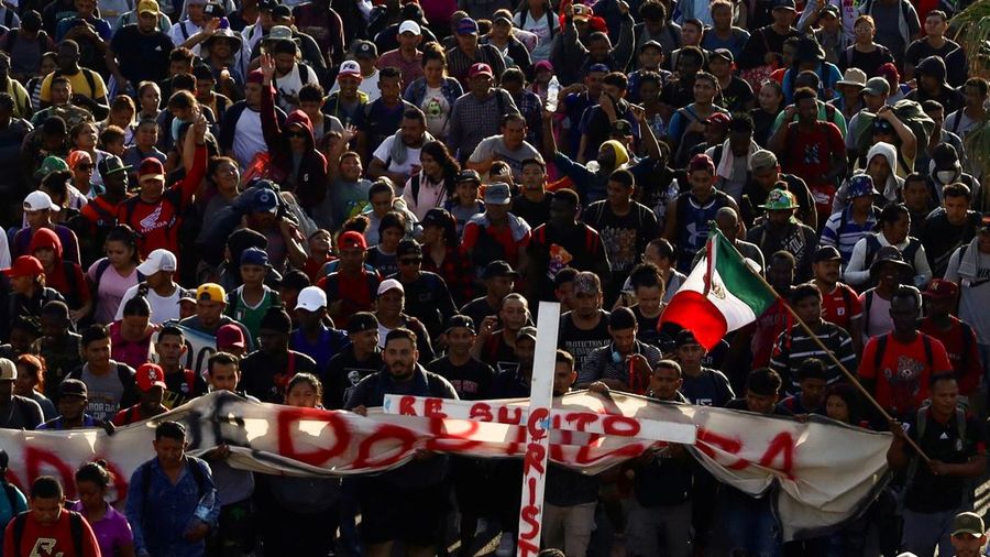 Migrants walk as they leave Tapachula in a caravan to attempt to reach the U.S. border, in the state of Chiapas, Mexico December 24, 2023. REUTERS/Jose Torres