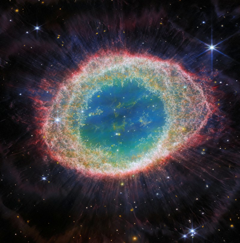 Intricate networks of gas and dust featured in the web-like spiral galaxy NGC 7496 are seen in a composite image taken by the James Webb Telescope and released by NASA on February 16, 2023. Eight red diffraction spikes extend out from its extremely bright core. Colorful dots in the background represent background galaxies. NASA/ESA/Handout via REUTERS   THIS IMAGE HAS BEEN SUPPLIED BY A THIRD PARTY