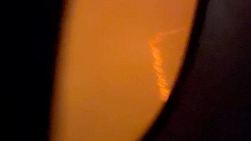 People sit amid smoke inside the Japan Airlines' A350 airplane in this screen grab obtained from social media video. Video Obtained by Reuters/via REUTERS  THIS IMAGE HAS BEEN SUPPLIED BY A THIRD PARTY.