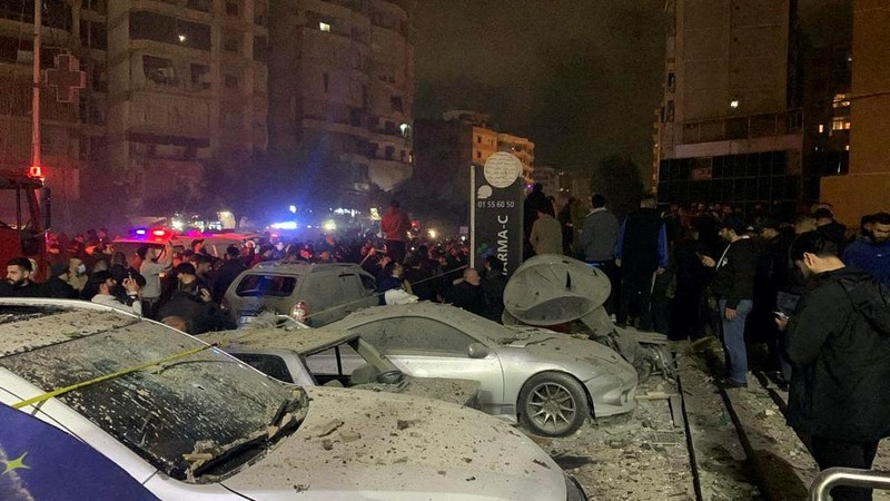 People gather near a damaged site following an explosion, in what security sources say is an Israeli drone strike, at the Beirut suburb of Dahiyeh, Lebanon January 2, 2024. REUTERS/Mohamed Azakir