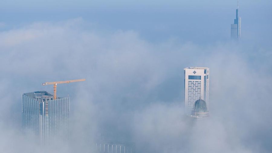 NANJING, CHINA - JANUARY 4, 2024 - Aerial photo shows skyscrapers looming in heavy fog in the main urban area of Nanjing, East China's Jiangsu province, Jan 4, 2024. (Photo credit should read CFOTO/Future Publishing via Getty Images)