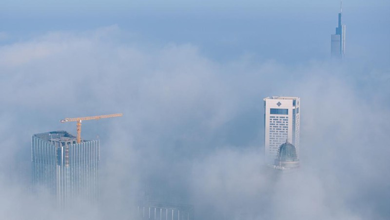 NANJING, CHINA - JANUARY 4, 2024 - Aerial photo shows skyscrapers looming in heavy fog in the main urban area of Nanjing, East China's Jiangsu province, Jan 4, 2024. (Photo credit should read CFOTO/Future Publishing via Getty Images)