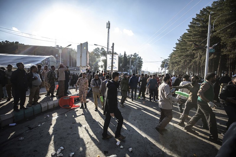 This image, provided by Maxar Technologies, shows cars and buses near the martyr's cemetery in Kerman, Iran Wednesday, Jan. 3, 2024 before, according to Iranian authorities, twin bomb blasts killed at least 103 people at an event honoring a prominent Iranian general slain in a U.S. airstrike in 2020. (Satellite image ©2023 Maxar Technologies via AP)