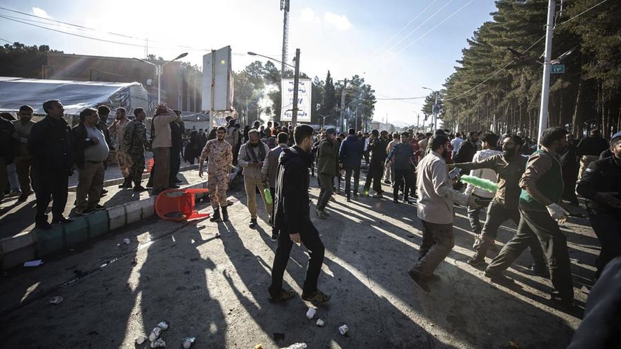 This image, provided by Maxar Technologies, shows cars and buses near the martyr's cemetery in Kerman, Iran Wednesday, Jan. 3, 2024 before, according to Iranian authorities, twin bomb blasts killed at least 103 people at an event honoring a prominent Iranian general slain in a U.S. airstrike in 2020. (Satellite image ©2023 Maxar Technologies via AP)