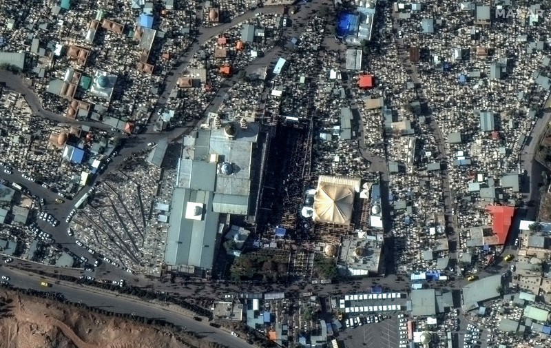 Iran Explosions This image, provided by Maxar Technologies, shows cars and buses near the martyr's cemetery in Kerman, Iran Wednesday, Jan. 3, 2024 before, according to Iranian authorities, twin bomb blasts killed at least 103 people at an event honoring a prominent Iranian general slain in a U.S. airstrike in 2020. (Satellite image ©2023 Maxar Technologies via AP)