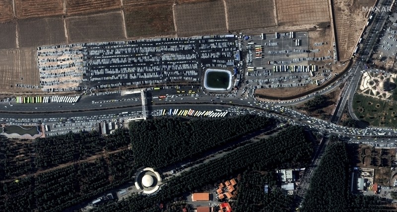 Iran Explosions This image, provided by Maxar Technologies, shows cars and buses near the martyr's cemetery in Kerman, Iran Wednesday, Jan. 3, 2024 before, according to Iranian authorities, twin bomb blasts killed at least 103 people at an event honoring a prominent Iranian general slain in a U.S. airstrike in 2020. (Satellite image ©2023 Maxar Technologies via AP)