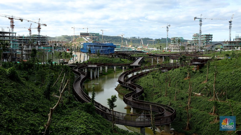 Suasana proyek pembangunan Ibu Kota Negara (IKN) Nusantara terus dikebut. Ditargetkan mulai bulan Juli 2024, Aparatur Sipil Negara (ASN), termasuk PNS dan PPPK, bisa mulai menempati kawasan ibu kota baru, Sepaku, Kabupaten Penajam Paser Utara, Kalimantan Timur, Kamis, (19/1/2024). (CNBC Indonesia/Tri Susilo) Suasana proyek pembangunan Ibu Kota Negara (IKN) Nusantara terus dikebut. Ditargetkan mulai bulan Juli 2024, Aparatur Sipil Negara (ASN), termasuk PNS dan PPPK, bisa mulai menempati kawasan ibu kota baru, Sepaku, Kabupaten Penajam Paser Utara, Kalimantan Timur, Kamis, (19/1/2024). (CNBC Indonesia/Tri Susilo)