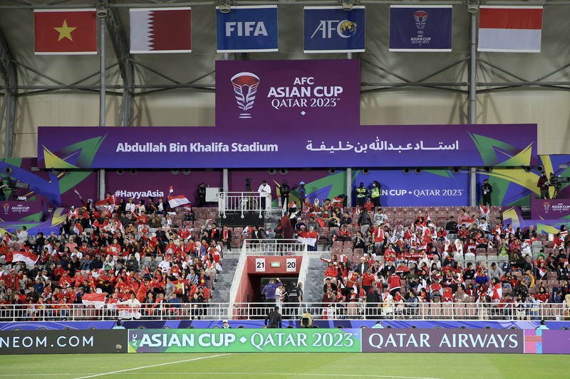 Fans watch the Asian Cup Group D soccer match between Vietnam and Indonesia at Abdullah Bin Khalifa Stadium in Doha, Qatar, Friday, Jan. 19, 2024. (AP Photo/Hussein Sayed)