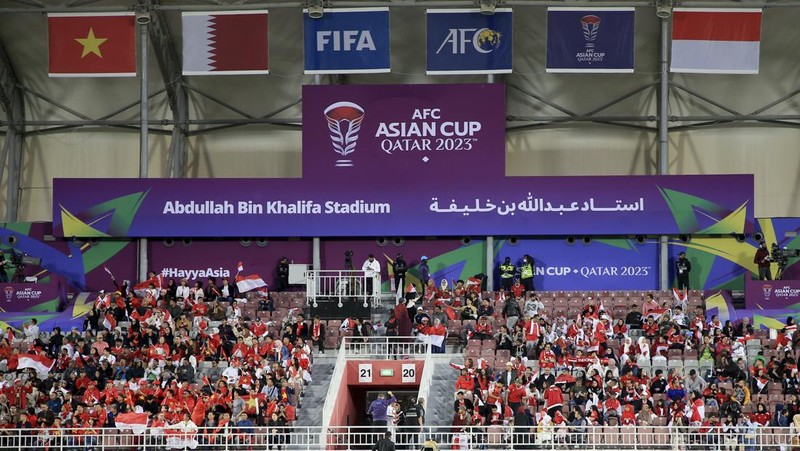 Fans watch the Asian Cup Group D soccer match between Vietnam and Indonesia at Abdullah Bin Khalifa Stadium in Doha, Qatar, Friday, Jan. 19, 2024. (AP Photo/Hussein Sayed)
