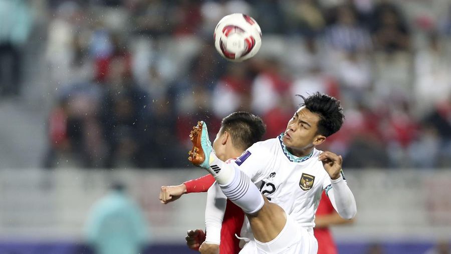 Fans watch the Asian Cup Group D soccer match between Vietnam and Indonesia at Abdullah Bin Khalifa Stadium in Doha, Qatar, Friday, Jan. 19, 2024. (AP Photo/Hussein Sayed)