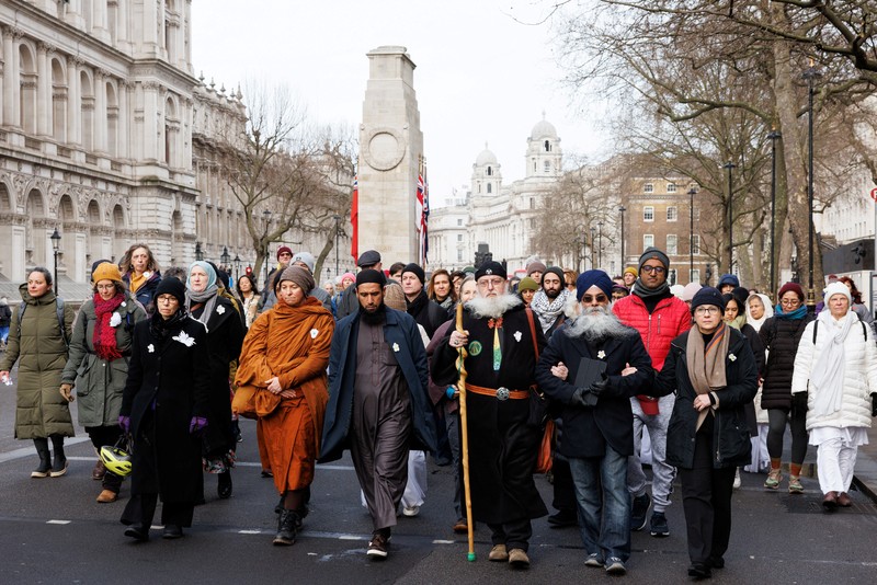 People take part in a cross-faith peace march attempting to bridge divisions over the conflict between Israel and the Palestinian Islamist group Hamas, which is causing rising levels of Islamophobia and antisemitism, in London, Britain, January 21, 2024 REUTERS/Belinda Jiao