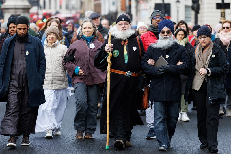 People take part in a cross-faith peace march attempting to bridge divisions over the conflict between Israel and the Palestinian Islamist group Hamas, which is causing rising levels of Islamophobia and antisemitism, in London, Britain, January 21, 2024 REUTERS/Belinda Jiao
