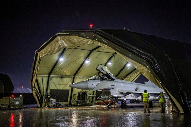 RAF Armourers (Weapon Technicians) prepare a Royal Air Force Typhoon FGR4.Royal Air Force Typhoon aircraft have conducted precision strike operations against Houthi military targets in response to further attacks on shipping in the Red Sea, in this undated handout image. UK MOD/Handout via REUTERS THIS IMAGE HAS BEEN SUPPLIED BY A THIRD PARTY NO RESALES. NO ARCHIVES. MANDATORY CREDIT