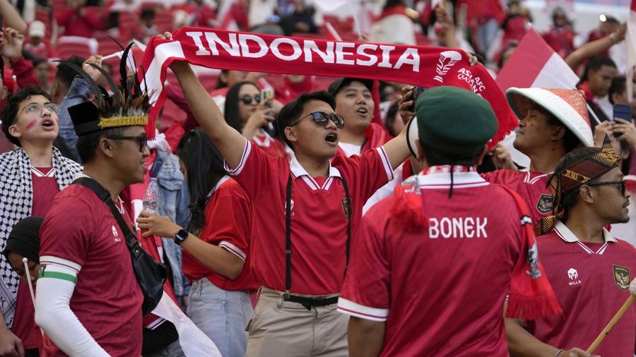 Indonesian fans cheer for their team during the Asian Cup Group D soccer match between Japan and Indonesia at Al Thumama in Doha, Qatar, Wednesday, Jan. 24, 2024. (AP Photo/Thanassis Stavrakis)