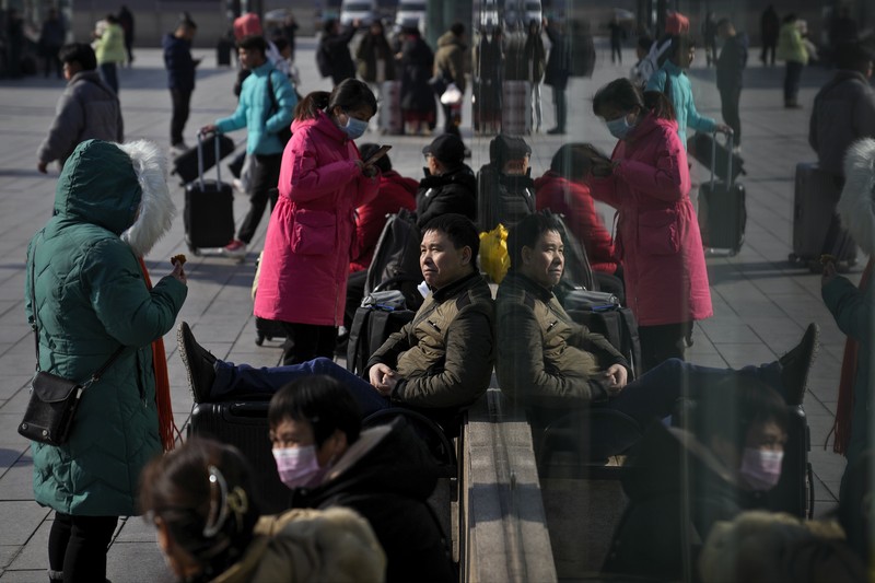 Suasana warga China mudik jelang liburan Tahun Baru Imlek. (AP Photo/Andy Wong) Suasana warga China mudik jelang liburan Tahun Baru Imlek. (AP Photo/Andy Wong)