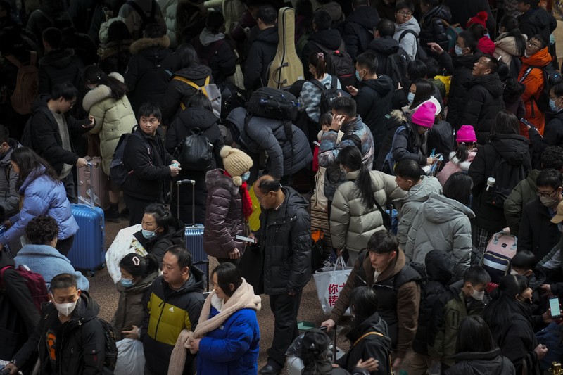 Suasana warga China mudik jelang liburan Tahun Baru Imlek. (AP Photo/Andy Wong) Suasana warga China mudik jelang liburan Tahun Baru Imlek. (AP Photo/Andy Wong)