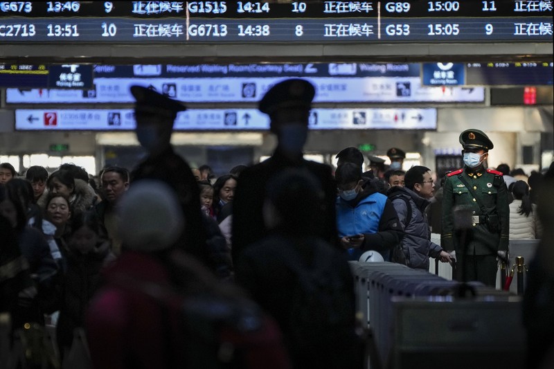 Suasana warga China mudik jelang liburan Tahun Baru Imlek. (AP Photo/Andy Wong) Suasana warga China mudik jelang liburan Tahun Baru Imlek. (AP Photo/Andy Wong)