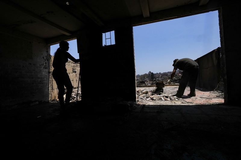 Foto udara memperlihatkan sisa-sisa rumah yang hangus akibat terdampak meluasnya kebaran hutan di Vina del Mar, Chili, Senin (5/2/2024). (REUTERS/Rodrigo Garrido) Foto udara memperlihatkan sisa-sisa rumah yang hangus akibat terdampak meluasnya kebaran hutan di Vina del Mar, Chili, Senin (5/2/2024). (REUTERS/Rodrigo Garrido)