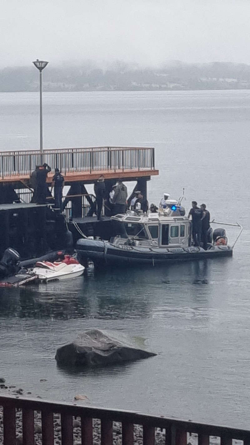 CHILE-CRASH/ Police officials work in Lago Ranco following Chile's former President Sebastian Pinera dies in helicopter crash, Chile, February 6, 2024. in this picture. Heverd Alarcon/Canal del sur /via REUTERS THIS IMAGE HAS BEEN SUPPLIED BY A THIRD PARTY. MANDATORY CREDIT. NO RESALES. NO ARCHIVES. REFILE - QUALITY REPEAT