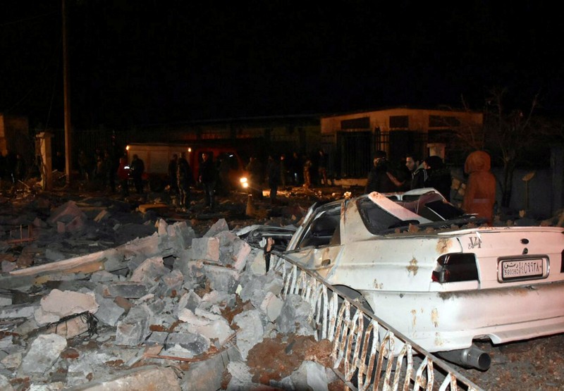 SYRIA-SECURITY/ISRAEL Rescuers search for survivors under the rubble of a damaged building, after Israeli missiles struck a number of sites in Syria's Homs province, according to state media, Syria February 7, 2024. SANA/Handout via REUTERS ATTENTION EDITORS - THIS IMAGE WAS PROVIDED BY A THIRD PARTY. REUTERS IS UNABLE TO INDEPENDENTLY VERIFY THIS IMAGE.