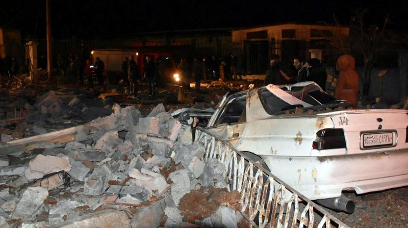 Rescuers search for survivors under the rubble of a damaged building, after Israeli missiles struck a number of sites in Syria's Homs province, according to state media, Syria February 7, 2024. SANA/Handout via REUTERS     ATTENTION EDITORS - THIS IMAGE WAS PROVIDED BY A THIRD PARTY. REUTERS IS UNABLE TO INDEPENDENTLY VERIFY THIS IMAGE.