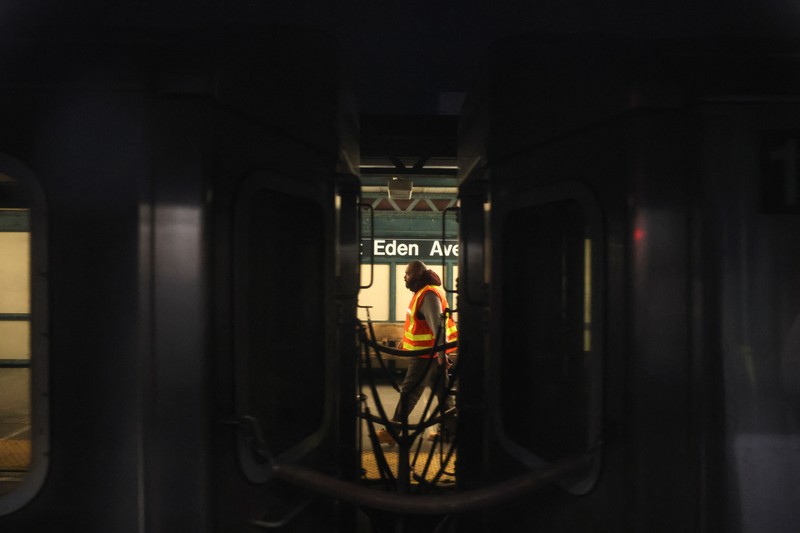 NEW YORK-SHOOTING/ A worker of the Metropolitan Transportation Authority (MTA) walks on a platform at the scene of a shooting at the Mount Eden Avenue subway station in the Bronx borough of New York City, U.S. February 12, 2024. REUTERS/Brendan McDermid