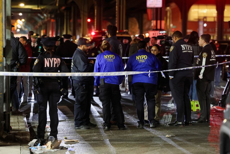 NEW YORK-SHOOTING/ A worker of the Metropolitan Transportation Authority (MTA) walks on a platform at the scene of a shooting at the Mount Eden Avenue subway station in the Bronx borough of New York City, U.S. February 12, 2024. REUTERS/Brendan McDermid