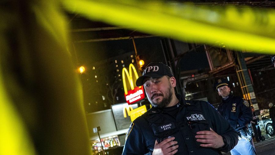 A worker of the Metropolitan Transportation Authority (MTA) walks on a platform at the scene of a shooting at the Mount Eden Avenue subway station in the Bronx borough of New York City, U.S. February 12, 2024. REUTERS/Brendan McDermid
