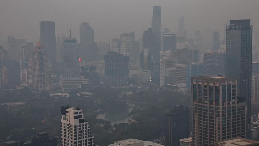 A view of the city amid air pollution during sunrise in Bangkok, Thailand, February 15, 2024. REUTERS/Athit Perawongmetha