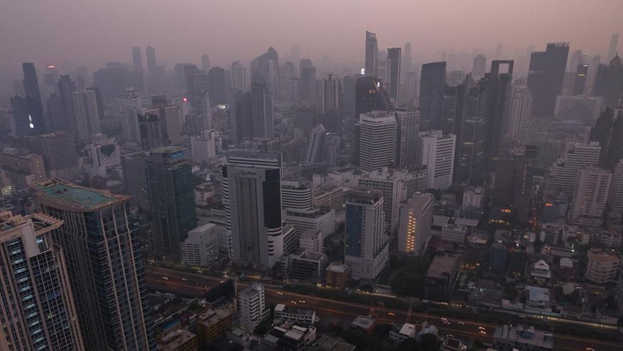 A view of the city amid air pollution during sunrise in Bangkok, Thailand, February 15, 2024. REUTERS/Athit Perawongmetha