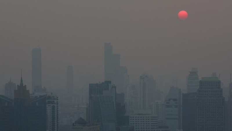A view of the city amid air pollution during sunrise in Bangkok, Thailand, February 15, 2024. REUTERS/Athit Perawongmetha