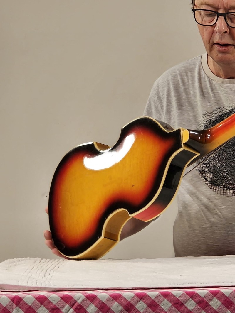 MUSIC-BEATLES/MCCARTNEY A man shows Paul McCartney's Beatles bass guitar after it was found and returned after 51 years, in an unknown location, United Kingdom, 2023, in this handout image obtained by Reuters on February 16, 2024. Nick Wass/The Lost Bass Project/Handout via REUTERS THIS IMAGE HAS BEEN SUPPLIED BY A THIRD PARTY NO RESALES. NO ARCHIVES. MANDATORY CREDIT