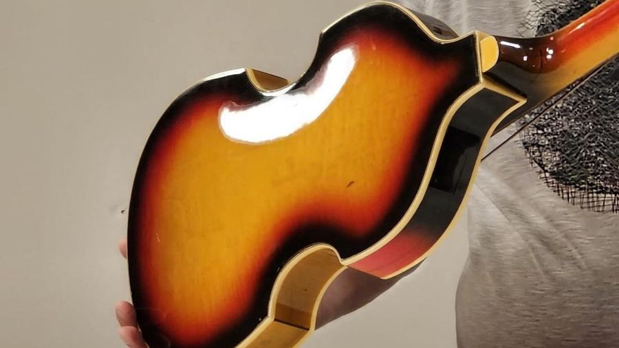 A man shows Paul McCartney's Beatles bass guitar after it was found and returned after 51 years, in an unknown location, United Kingdom, 2023, in this handout image obtained by Reuters on February 16, 2024. Nick Wass/The Lost Bass Project/Handout via REUTERS    THIS IMAGE HAS BEEN SUPPLIED BY A THIRD PARTY NO RESALES. NO ARCHIVES. MANDATORY CREDIT