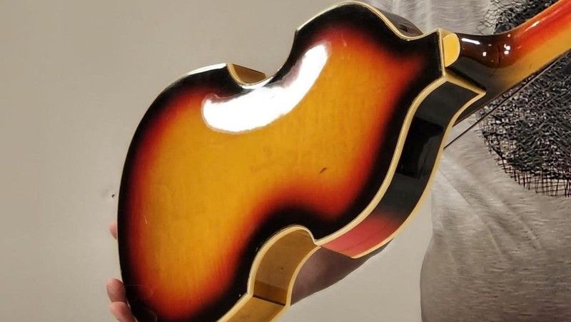 A man shows Paul McCartney's Beatles bass guitar after it was found and returned after 51 years, in an unknown location, United Kingdom, 2023, in this handout image obtained by Reuters on February 16, 2024. Nick Wass/The Lost Bass Project/Handout via REUTERS    THIS IMAGE HAS BEEN SUPPLIED BY A THIRD PARTY NO RESALES. NO ARCHIVES. MANDATORY CREDIT