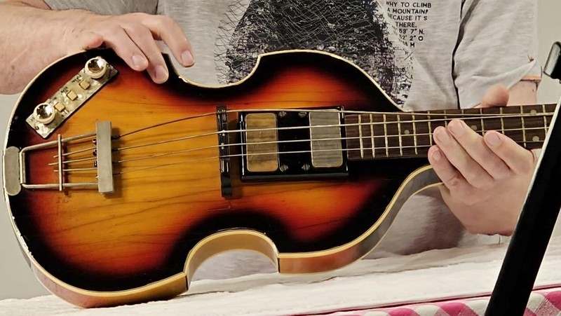 A man shows Paul McCartney's Beatles bass guitar after it was found and returned after 51 years, in an unknown location, United Kingdom, 2023, in this handout image obtained by Reuters on February 16, 2024. Nick Wass/The Lost Bass Project/Handout via REUTERS    THIS IMAGE HAS BEEN SUPPLIED BY A THIRD PARTY NO RESALES. NO ARCHIVES. MANDATORY CREDIT