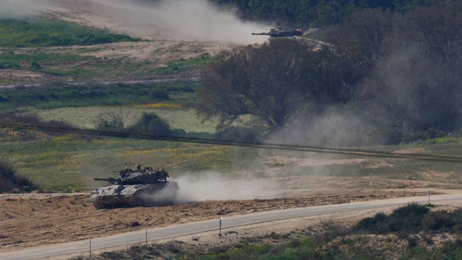 Israeli tanks manoeuvre near the Israel-Gaza border, amid the ongoing conflict between Israel and the Palestinian Islamist group Hamas, as seen from Israel, February 24, 2024. REUTERS/Susana Vera
