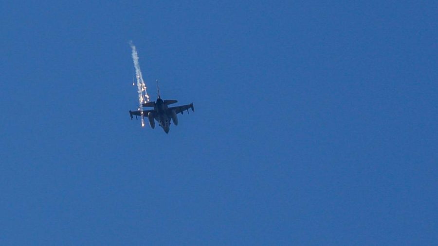 An Israeli Air Force F-16 fighter jet releases flares in the sky near the Israeli border with Gaza amid the ongoing conflict between Israel and the Palestinian Islamist group Hamas, as seen from Israel, February 24, 2024. REUTERS/Susana Vera