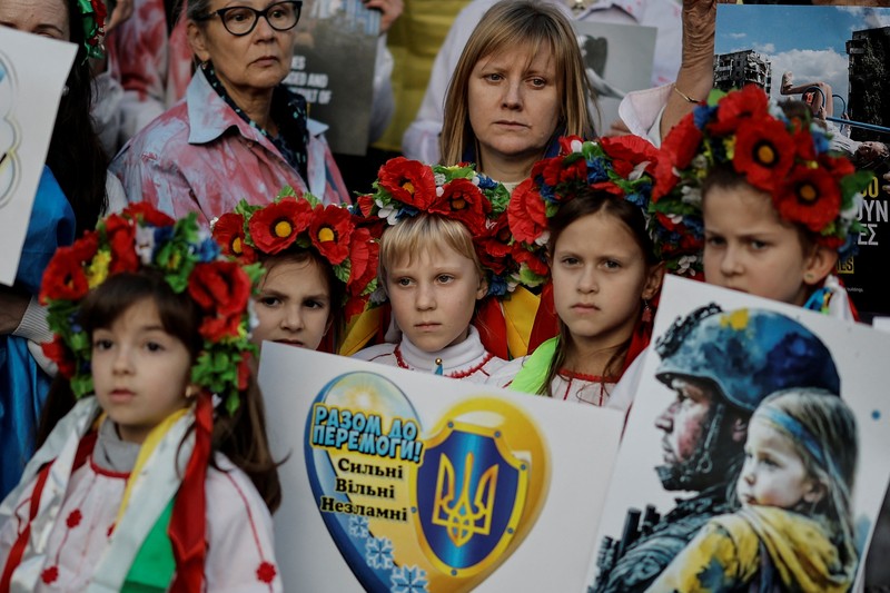 A woman reacts as she visits the grave of her relative, a killed Ukrainian defender, on the day of the second anniversary of Russia's attack on Ukraine, in Lviv, Ukraine February 24, 2024. REUTERS/Pavlo Palamarchuk