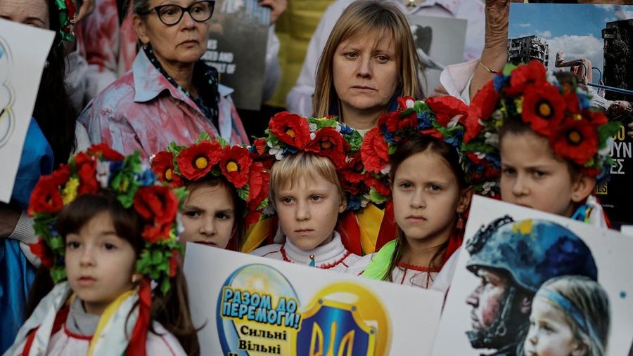 A woman reacts as she visits the grave of her relative, a killed Ukrainian defender, on the day of the second anniversary of Russia's attack on Ukraine, in Lviv, Ukraine February 24, 2024. REUTERS/Pavlo Palamarchuk