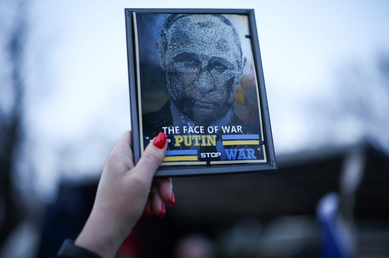 A woman reacts as she visits the grave of her relative, a killed Ukrainian defender, on the day of the second anniversary of Russia's attack on Ukraine, in Lviv, Ukraine February 24, 2024. REUTERS/Pavlo Palamarchuk