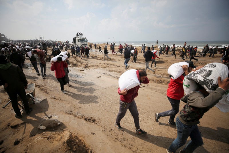 U.S. Air Force drops humanitarian aid for Gaza residents, in this screengrab from a video released on March 5, 2024. US Central Command via X/Handout via REUTERS    THIS IMAGE HAS BEEN SUPPLIED BY A THIRD PARTY