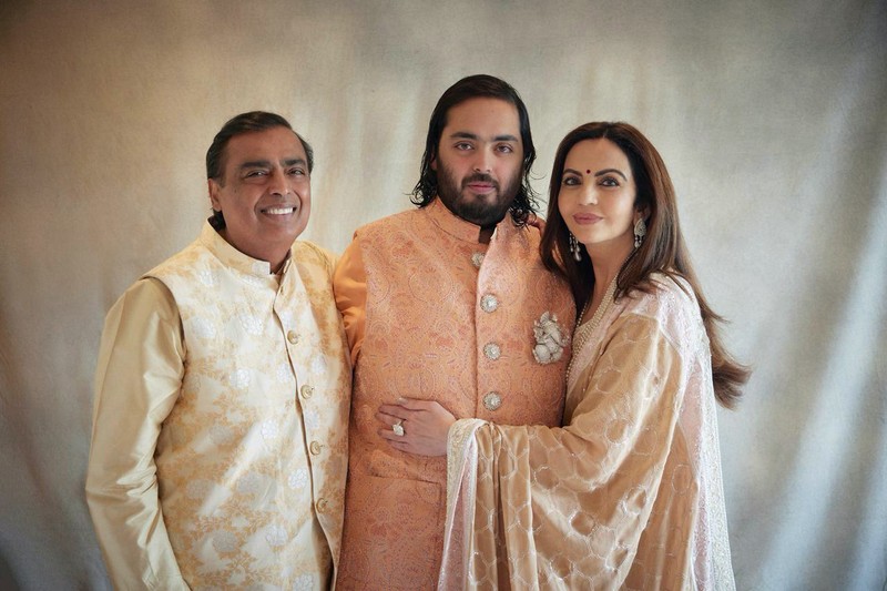 INDIA-AMBANI/MARRIAGE Mukesh Ambani, the Chairman of Reliance Industries, Radhika Merchant, Anant Ambani, Nita Ambani, Rihanna, Isha Piramal, Anand Piramal, Shloka Mehta Ambani and Akash Ambani react during pre-wedding celebrations of Anant and Radhika in Jamnagar, Gujarat, India, March 1, 2024. Reliance Industries/Handout via REUTERS THIS IMAGE HAS BEEN SUPPLIED BY A THIRD PARTY. NO RESALES. NO ARCHIVES.