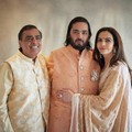 This photograph released by the Reliance group shows from L to R, billionaire industrialist Mukesh Ambani, son Anant and wife Nita, posing for a photograph as guests gather to celebrate Anant's wedding in Jamnagar, India, Saturday, Mar. 02, 2024. (Re