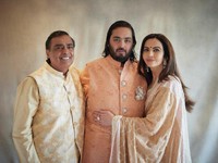 This photograph released by the Reliance group shows from L to R, billionaire industrialist Mukesh Ambani, son Anant and wife Nita, posing for a photograph as guests gather to celebrate Anant's wedding in Jamnagar, India, Saturday, Mar. 02, 2024. (Re