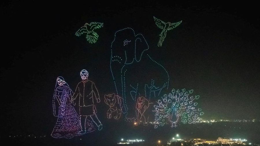 Mukesh Ambani, the Chairman of Reliance Industries, Radhika Merchant, Anant Ambani, Nita Ambani, Rihanna, Isha Piramal, Anand Piramal, Shloka Mehta Ambani and Akash Ambani react during pre-wedding celebrations of Anant and Radhika in Jamnagar, Gujarat, India, March 1, 2024. Reliance Industries/Handout via REUTERS THIS IMAGE HAS BEEN SUPPLIED BY A THIRD PARTY. NO RESALES. NO ARCHIVES.