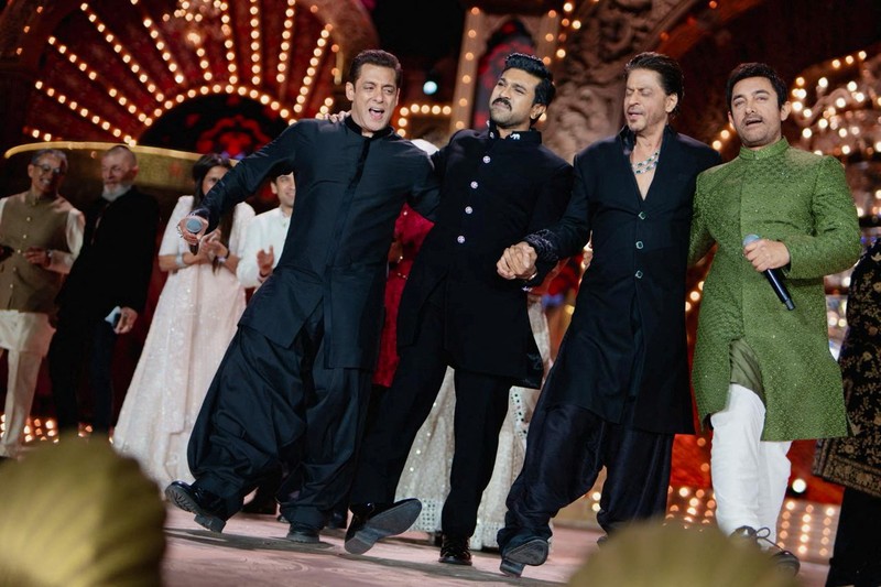 Mukesh Ambani, the Chairman of Reliance Industries, Radhika Merchant, Anant Ambani, Nita Ambani, Rihanna, Isha Piramal, Anand Piramal, Shloka Mehta Ambani and Akash Ambani react during pre-wedding celebrations of Anant and Radhika in Jamnagar, Gujarat, India, March 1, 2024. Reliance Industries/Handout via REUTERS THIS IMAGE HAS BEEN SUPPLIED BY A THIRD PARTY. NO RESALES. NO ARCHIVES.