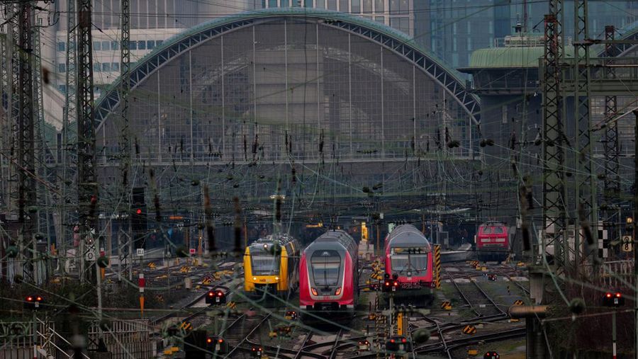 Trains operate outside the central train station as Germany?s GDL train drivers? union begins a 35 hour long strike over a wage dispute with Deutsche Bahn rail operator after rejecting a new tariff offer in Frankfurt, Germany, March 6, 2024.   REUTERS/Kai Pfaffenbach