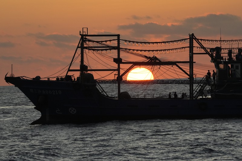 In this image made from video provided by the Philippine Coast Guard, Philippine resupply vessel Unaizah May 4, center, is hit by two Chinese coast guard water canon blasts, causing injuries to multiple crew members as they tried to enter the Second Thomas Shoal, locally known as Ayungin Shoal, in the disputed South China Sea, Tuesday, March 5, 2024. Chinese and Philippine coast guard vessels collided in the disputed South China Sea and multiple Filipino crew members were injured in high-seas confrontations Tuesday as Southeast Asian leaders gathered for a summit that was expected to touch on Beijing's aggression at sea. (Philippine Coast Guard via AP)